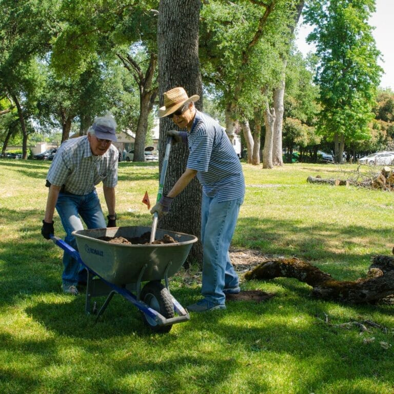 two men with a wheelbarrow