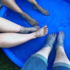 soaking feet in kiddie pool to stay cool