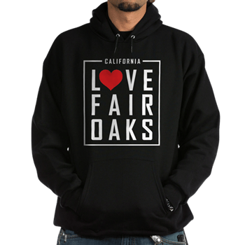 man wearing a hoodie sweatshirt with the love fair oaks logo