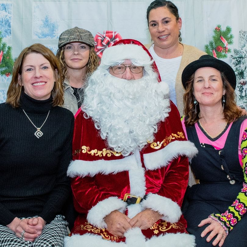 group of friends with santa