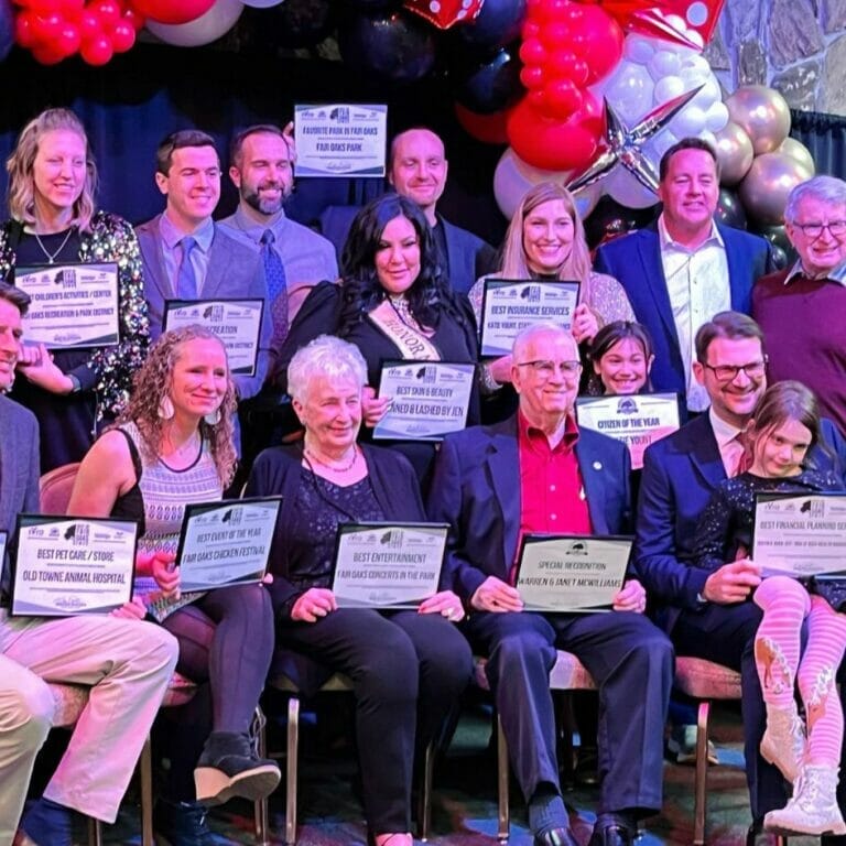 winners of best of fair oaks 2022 gather on stage for a group photo