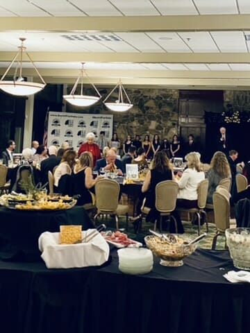 room full of people sitting at tables